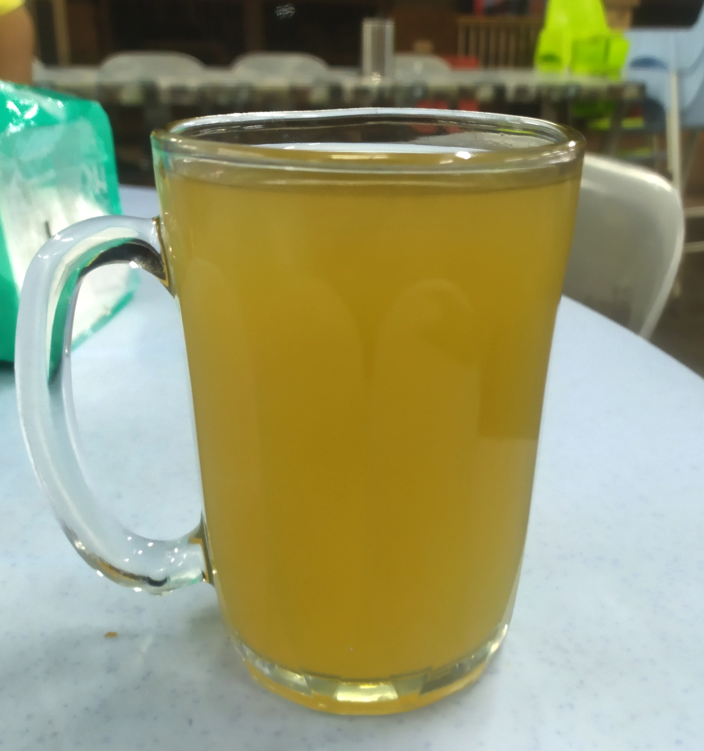 Lemongrass ginger revival green tea wellness blend in glass cup